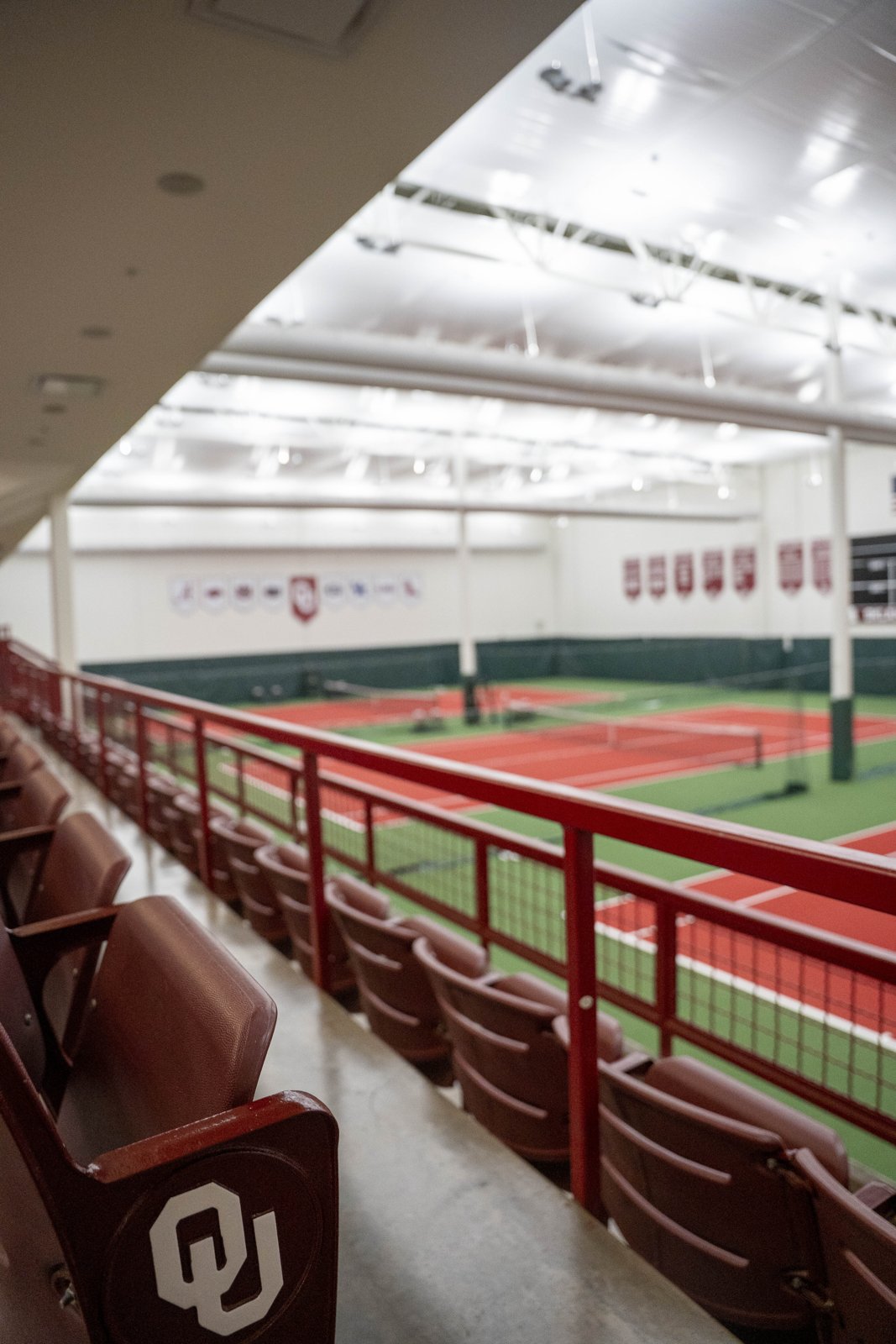 Indoor courts at the Gregg Wadley facility at the University of Oklahoma seen from the seating